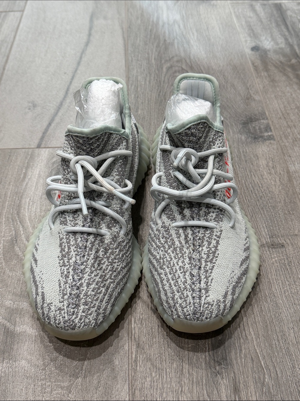 Never worn women’s Adidas Yeezy Grey/ light blue Knit Sneaker- 8 1/2
